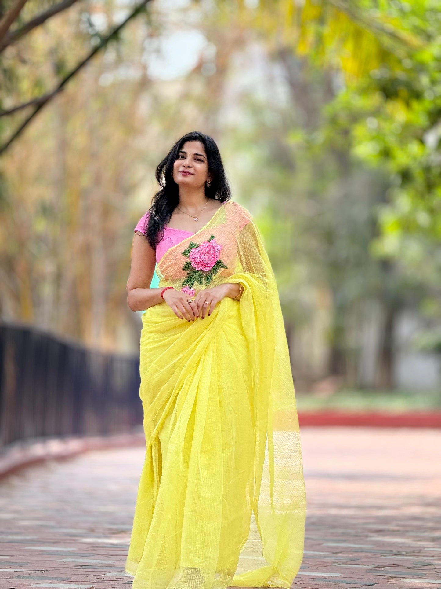Pink embroidered butter yellow kota saree