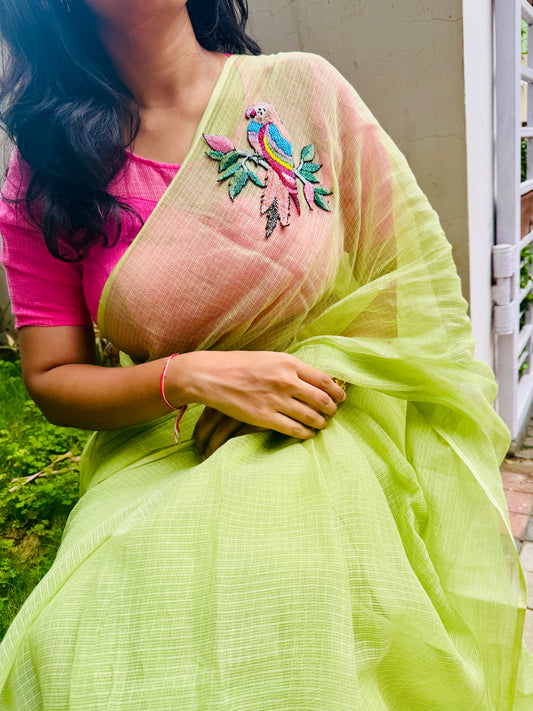 Parrot embroidered green saree with pink unstitched blouse