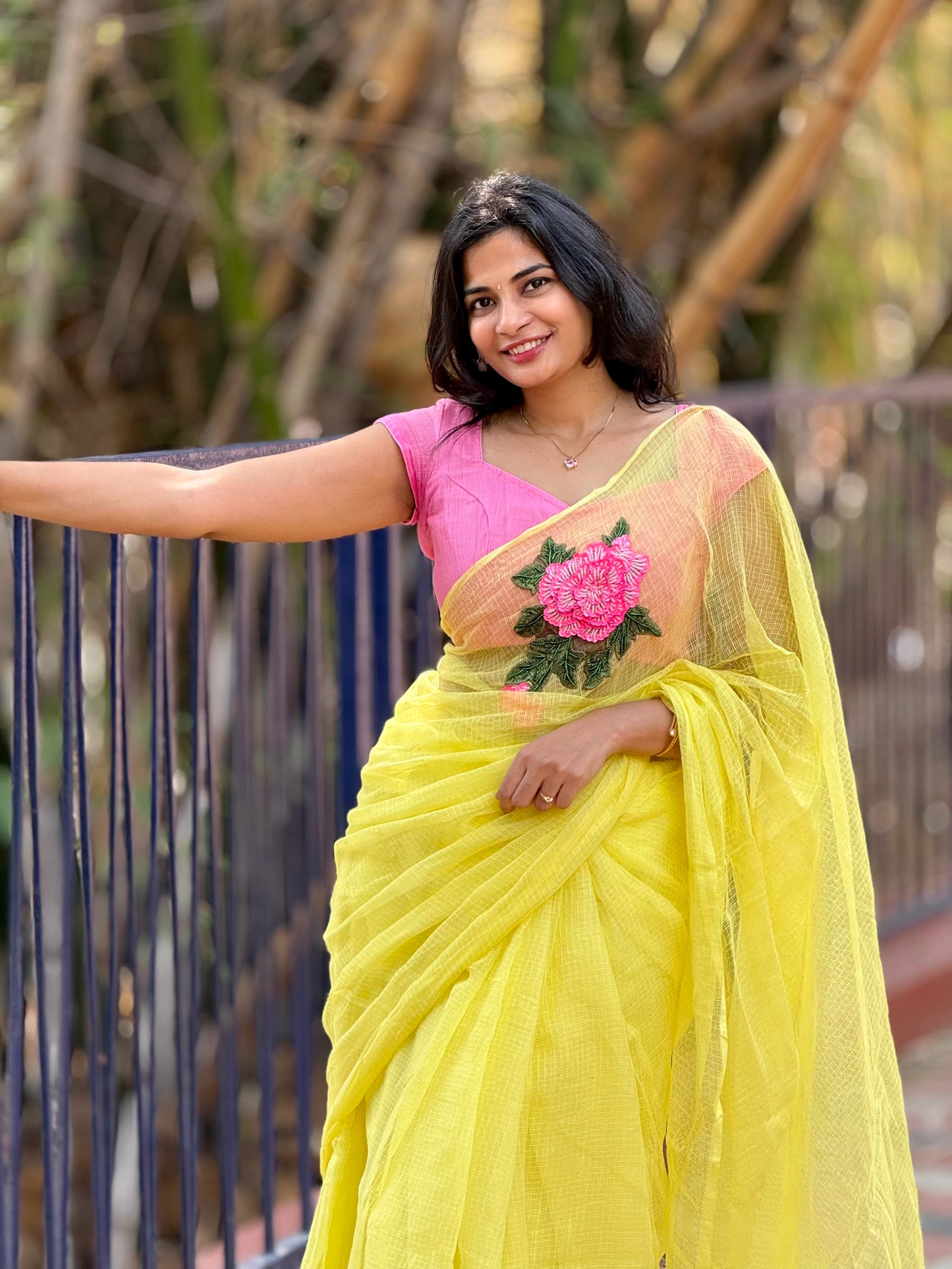 Pink embroidered butter yellow kota saree
